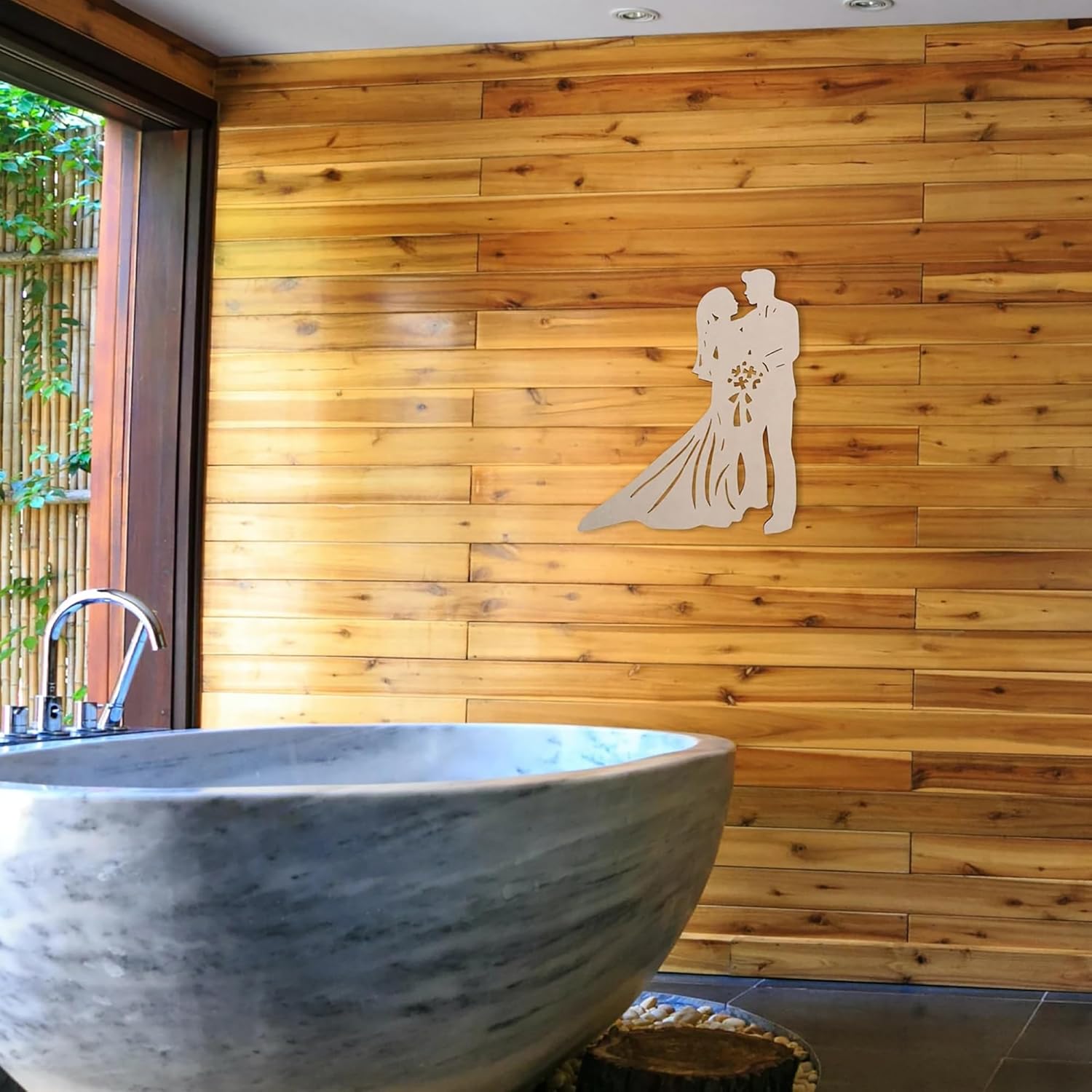 Bathroom with wooden wall, stone sink, and decorative cutout of a couple.