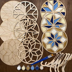 Wooden geometric shapes with paint and brushes on a brown background