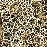 Stack of wooden flower-shaped beads in natural and brown tones.