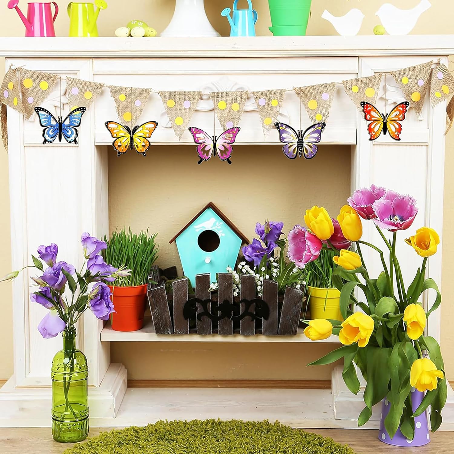 Decorative shelf with flowers, a birdhouse, and butterfly decorations on a fireplace mantle.