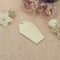 Blank beige tag on a textured fabric background with decorative elements