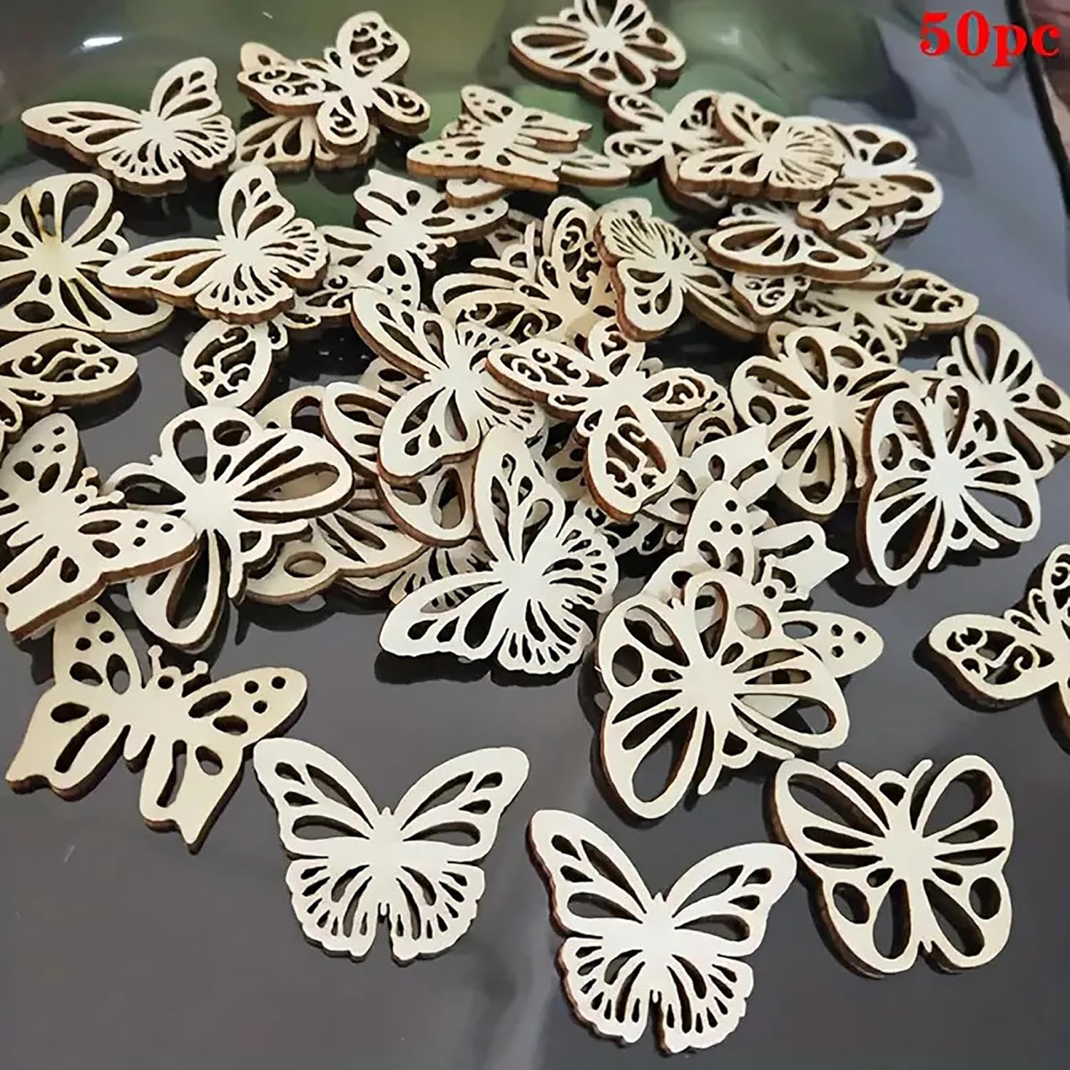 50 wooden butterfly decorations on a reflective surface