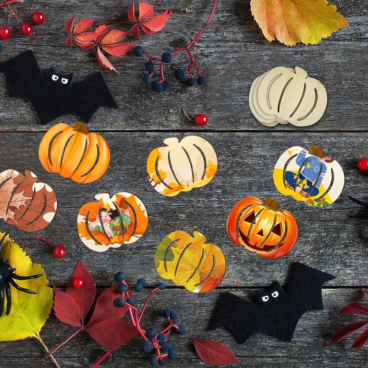 Halloween-themed decorations including pumpkins, bats, and leaves on a wooden surface.