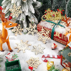 Christmas-themed decorations including a deer, snowflakes, and wrapped gifts on a snowy surface.