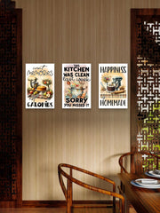 Three humorous kitchen-themed posters on a wall above a wooden dining table.