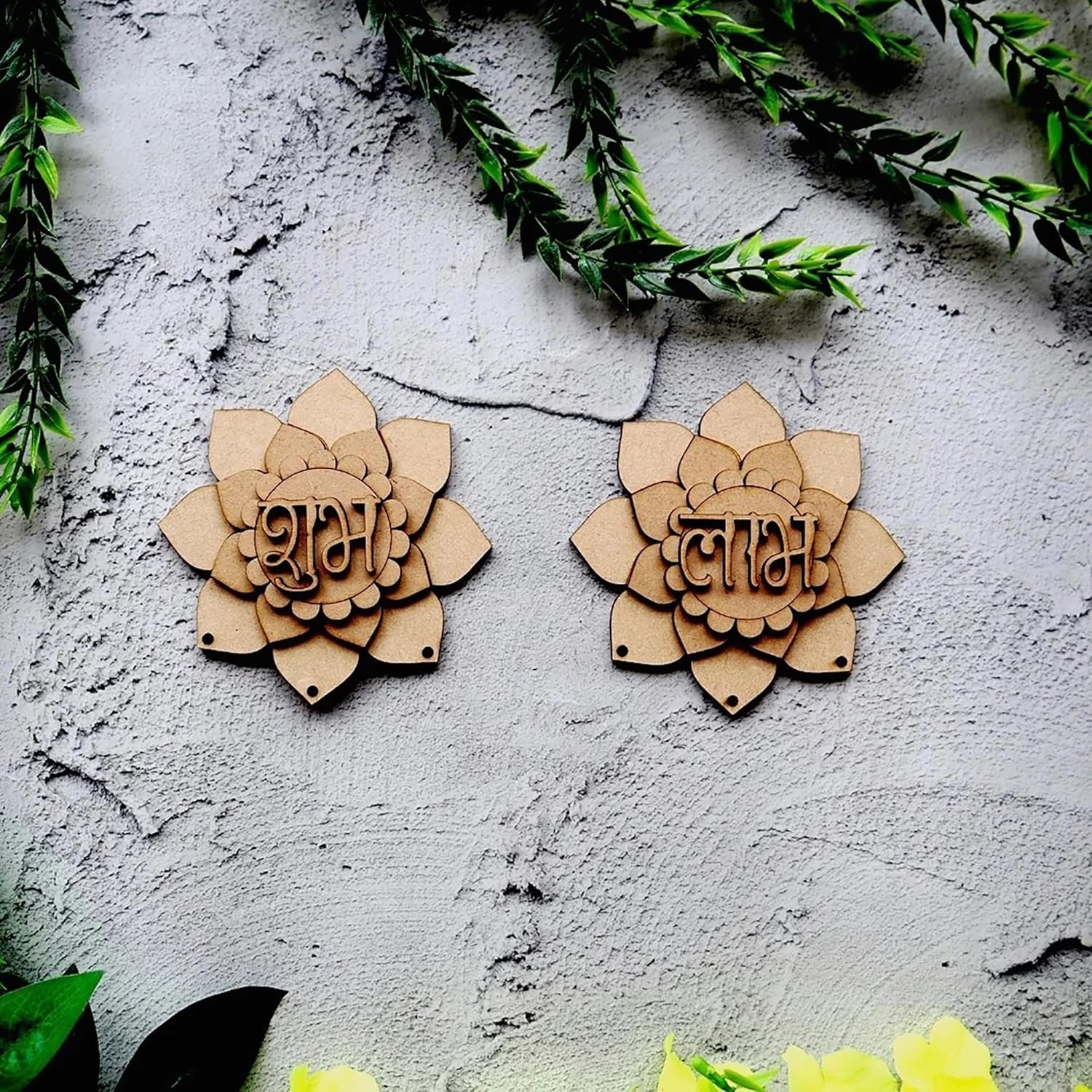 Two wooden lotus-shaped decorations with engraved text on a textured wall.