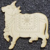 Decorative wooden bull figure with intricate patterns on a dark textured background