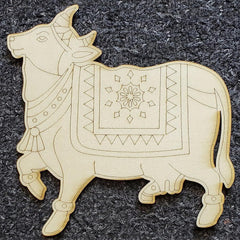 Decorative wooden bull figure with intricate patterns on a dark textured background