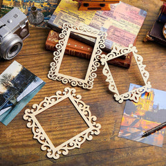 Decorative wooden frames on a wooden surface with vintage books and photos.