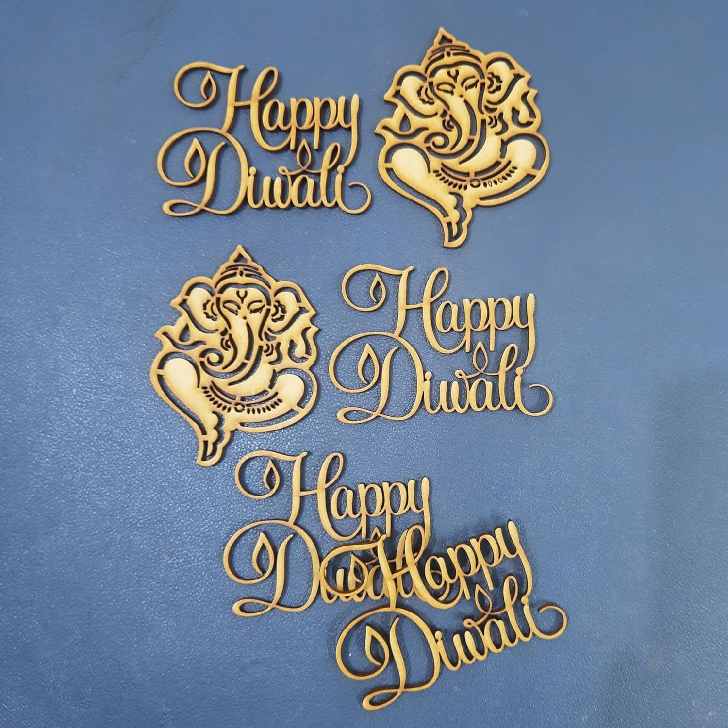 Gold 'Happy Diwali' and Ganesha designs on a blue background