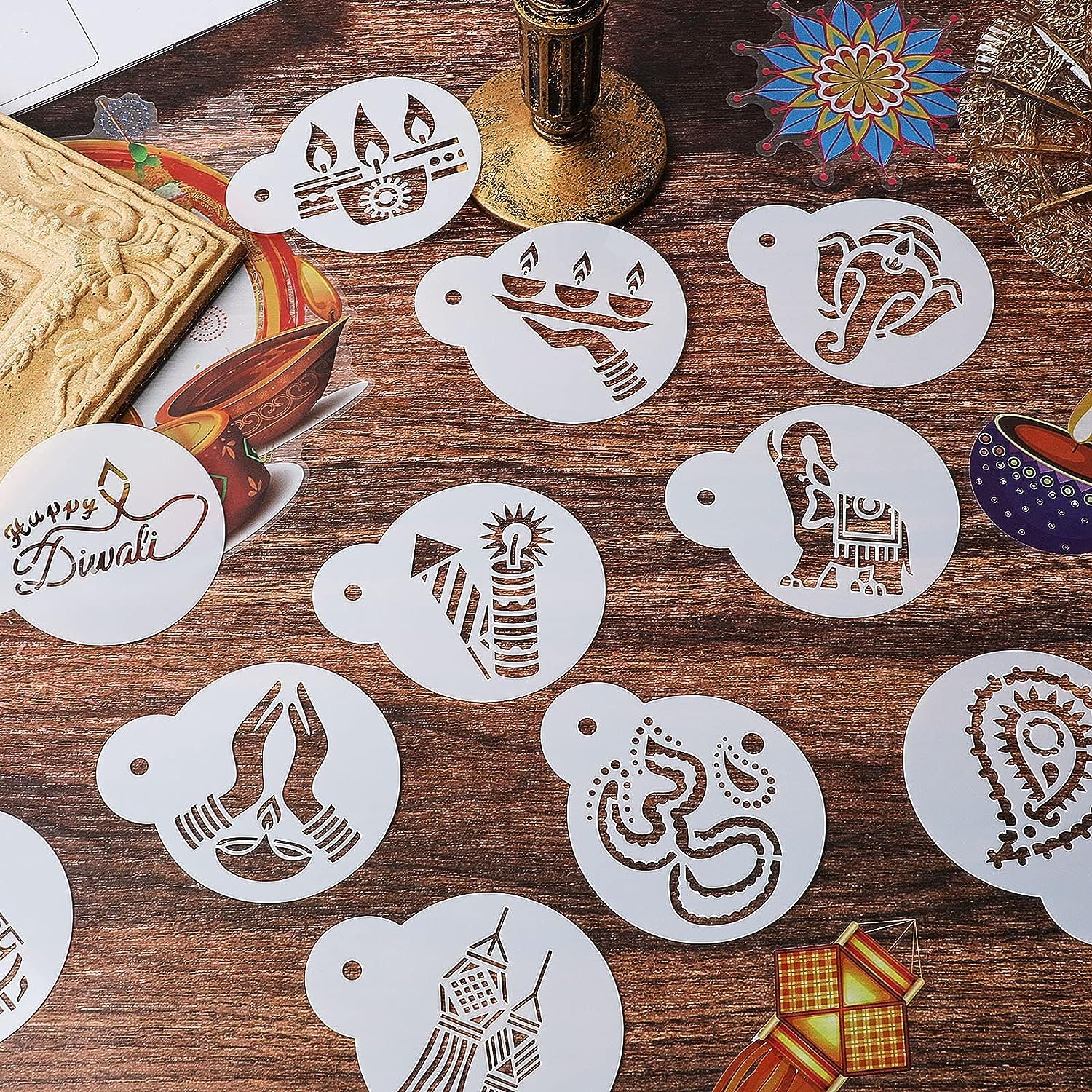 Set of Diwali-themed stencils on a wooden surface with decorative elements.