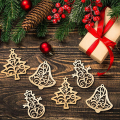 Wooden Christmas ornaments on a wooden surface with a gift and decorations.