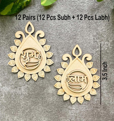 Pair of decorative earrings with intricate designs on a gray surface.