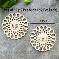 Two wooden decorative pieces with intricate designs on a gray surface.