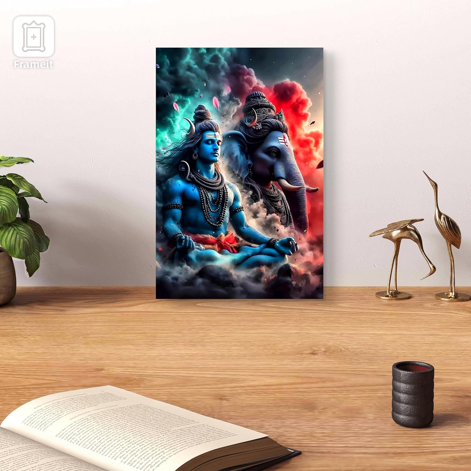 Canvas print of a deity and elephant on a wall with decor items below