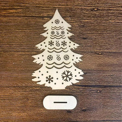 Decorative Christmas tree light on a wooden surface