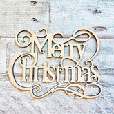 Wooden 'Merry Christmas' decoration on a rustic wooden background
