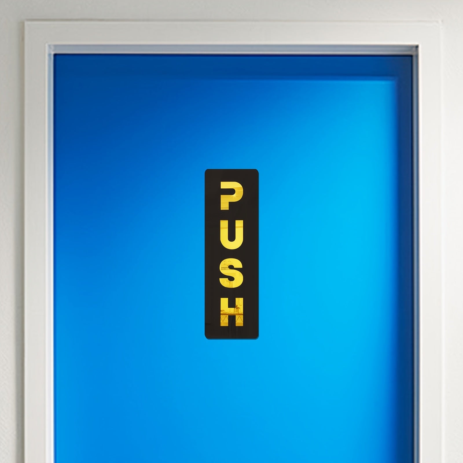 Blue door with a 'PUSH' sign in yellow on a black background