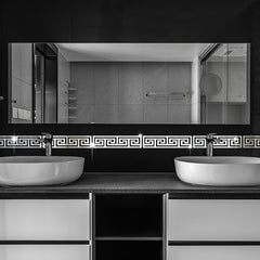 Bathroom vanity with two sinks and a large mirror above.