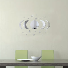 Dining room with a table and chairs, featuring decorative wall mirrors on a light green wall.