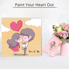 Cartoon illustration of a couple with a heart and a pink gift box on a white background.