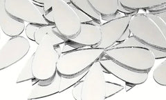 Close-up of a clear glass chandelier with reflective surface