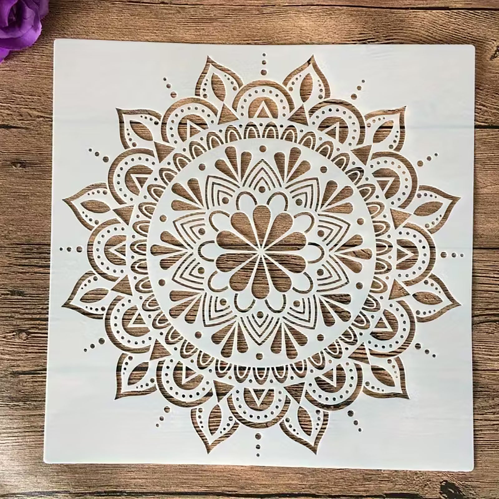 Crafted from durable PET, this reusable mandala stencil
