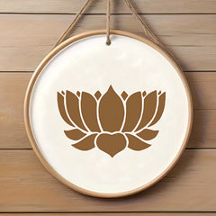 Decorative wall hanging with a brown lotus flower design on a white background, hanging against a wooden wall.
