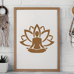 Framed artwork with a brown lotus flower and meditating figure on a white background, leaning against a white brick wall.