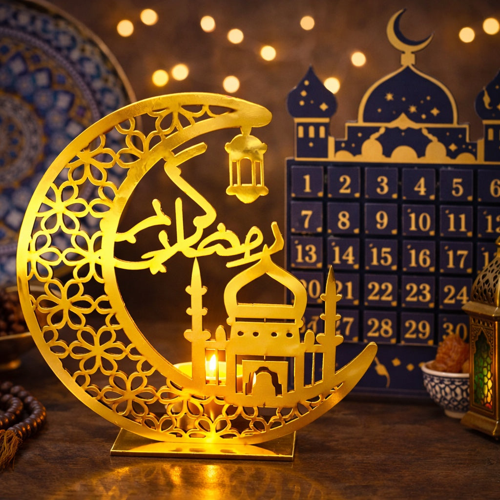 Decorative lamp shaped like a crescent moon with a mosque silhouette, placed in front of a blue advent calendar.