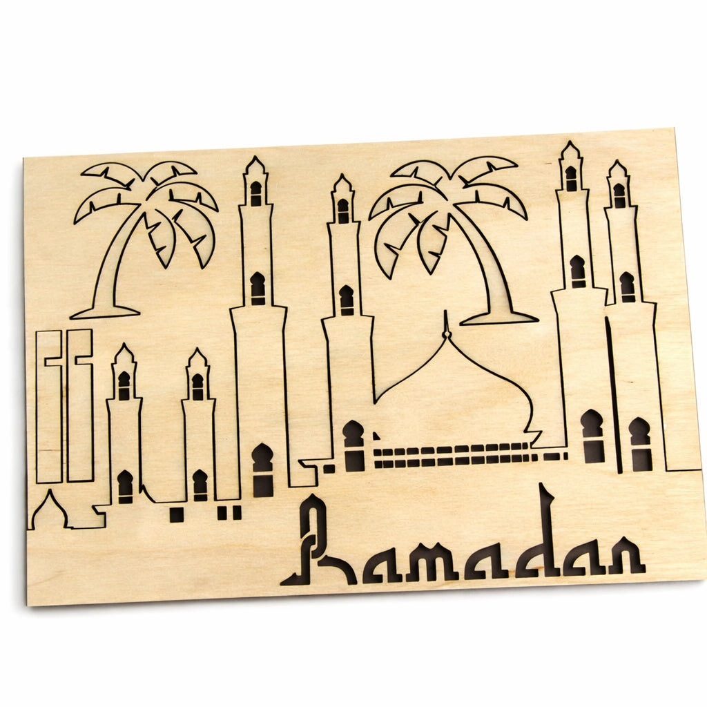 Wooden plaque with Islamic architectural design and 'Ramadan' text on a white background