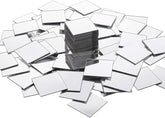 Stack of small square mirrors on a white background