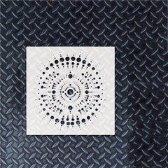 White square with black circular pattern on a textured black background