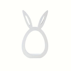 White bunny-shaped ring holder on a white background