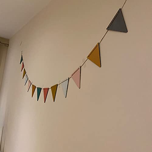 Colorful triangular banner hanging on a plain wall