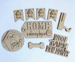 Set of wooden dog-themed decorative pieces on a light blue background