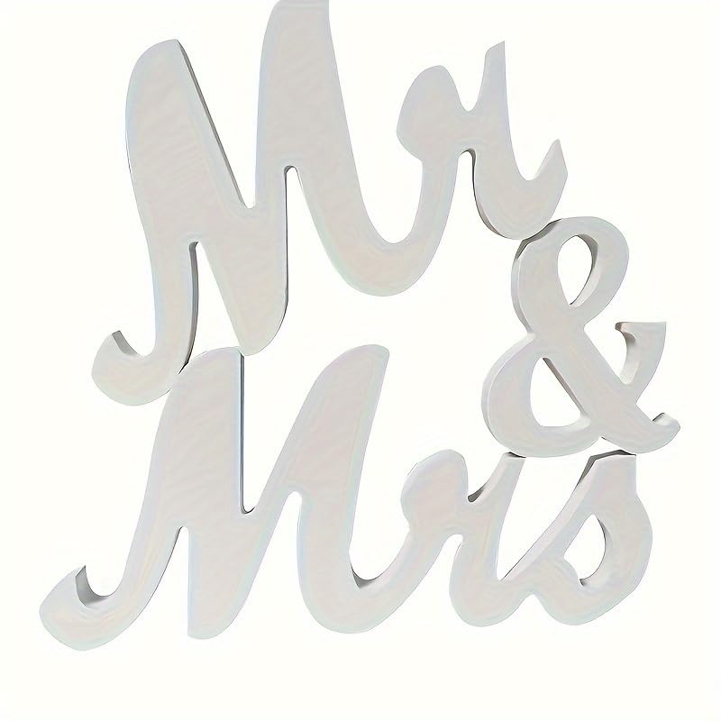 White decorative sign with 'Mr & Mrs' text on a white background