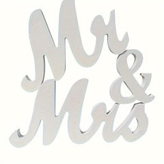 White decorative sign with 'Mr & Mrs' text on a white background