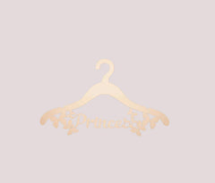 Gold hanger with 'Princess' text on a light gray background