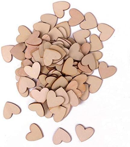 Pile of wooden heart shapes on a white background