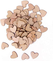 Pile of wooden heart shapes on a white background