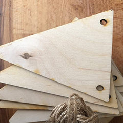 Stack of wooden tags with holes on a wooden surface