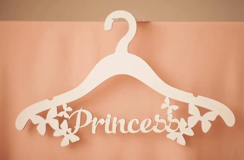 White hanger with 'Princess' text on a peach background