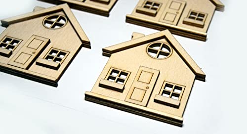 Small wooden house models on a white background