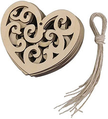 Heart-shaped wooden box with intricate cut-out design and a string on a white background