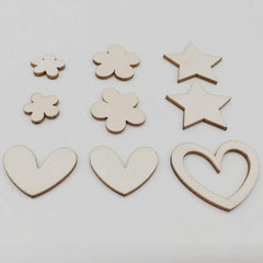 Wooden shapes including stars and hearts on a white background