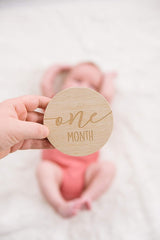 wooden milestone discs baby photoshoot