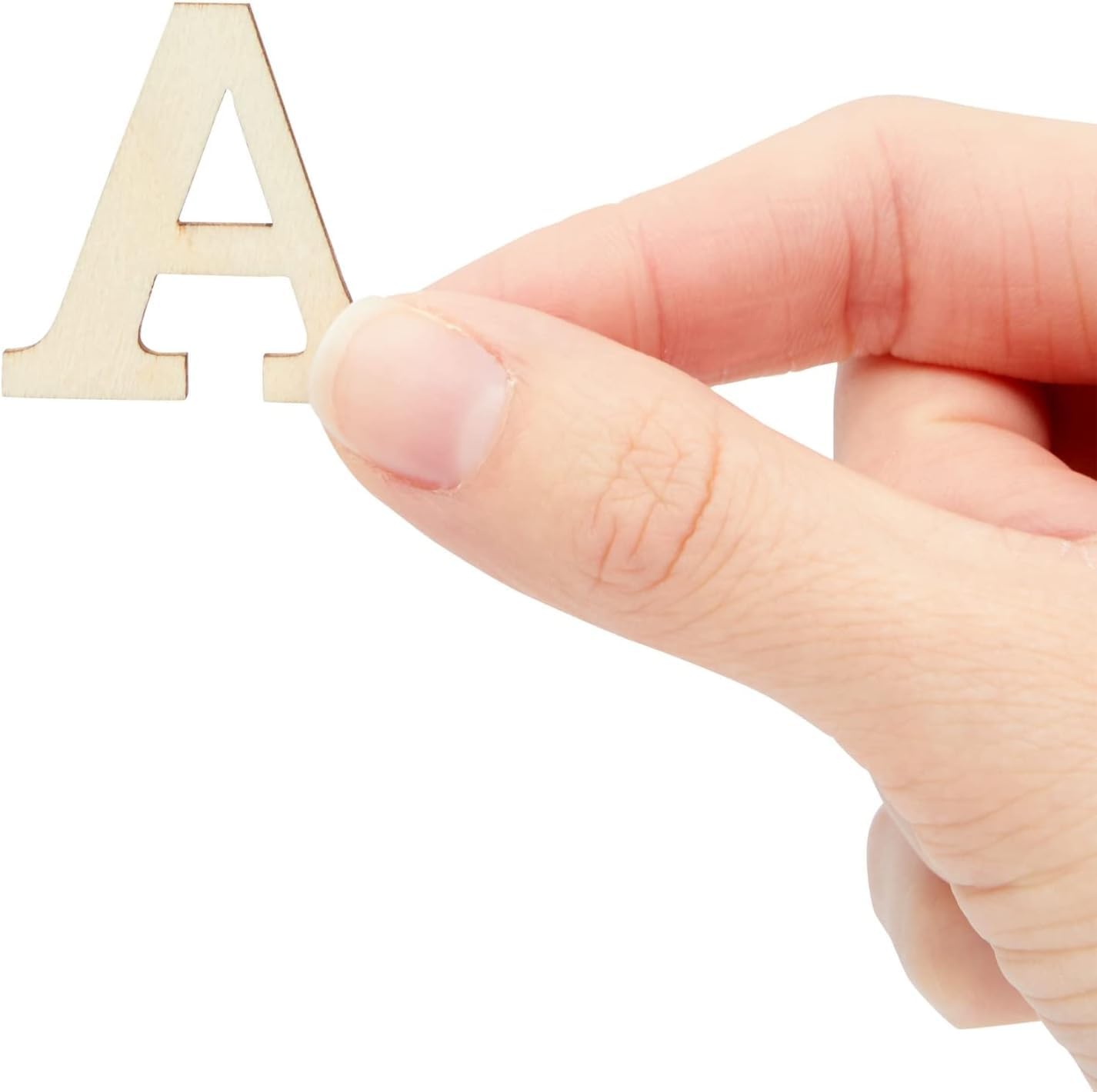 Hand holding a wooden letter 'A' on a white background