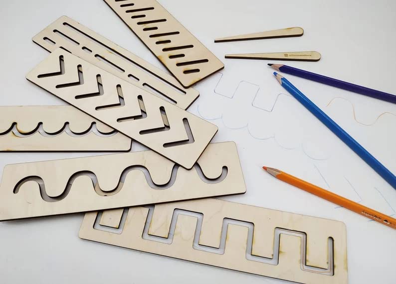 Wooden maze puzzles with pencils on a white surface
