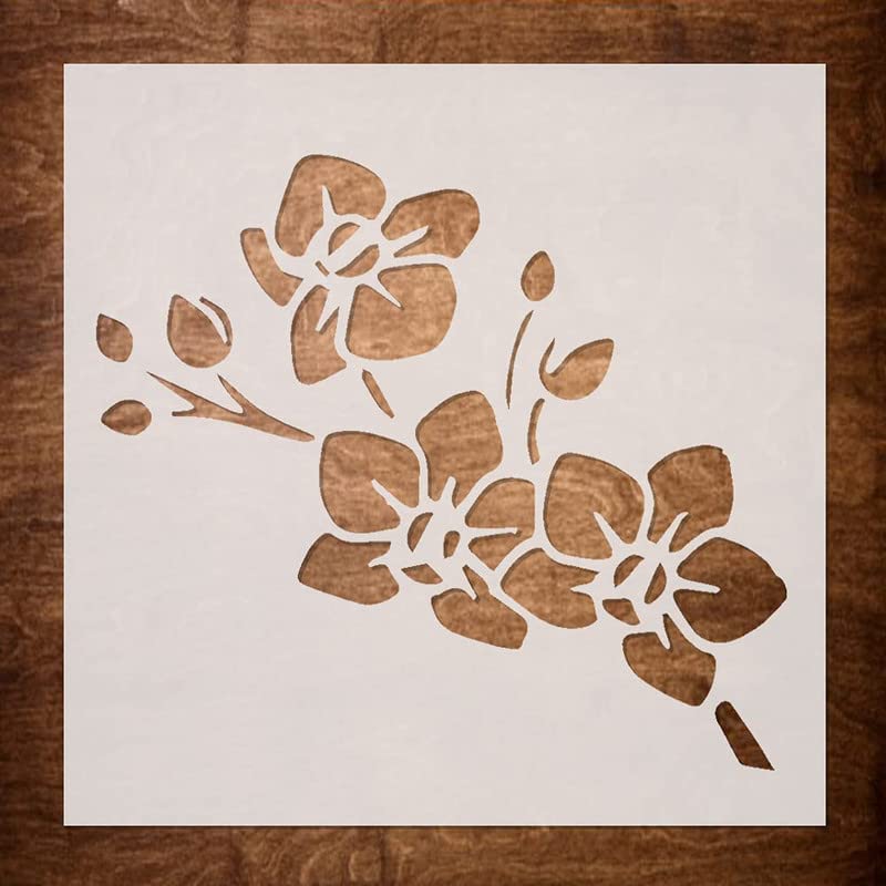 Floral stencil on a white sheet with a wooden background